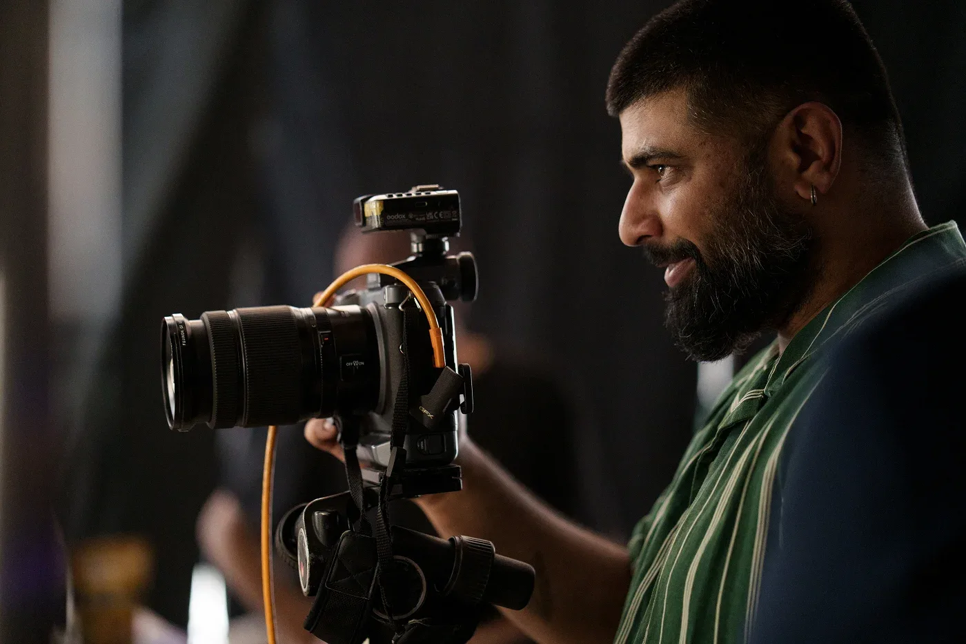 Devang Singh lining up a shot through the camera
